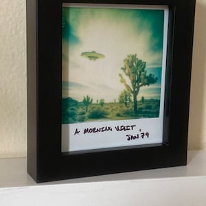 Framed Polaroid of a UFO Flying over Joshua Trees image 1