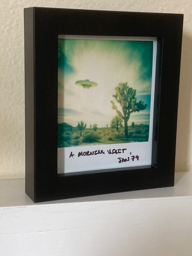 Framed Polaroid of a UFO Flying over Joshua Trees image 1