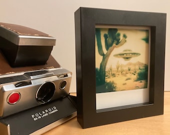 Color Polaroid of a UFO Flying over Joshua Trees - The Hadrians