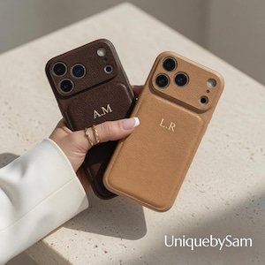 May include: Two textured leather phone cases, one dark brown with gold embossed initials A.M. and one tan with gold embossed initials L.R. Both cases feature a raised camera cutout area and a smooth, rectangular central panel on the back.