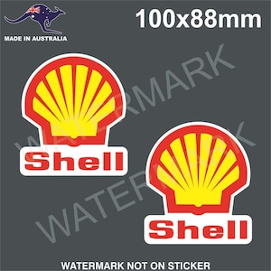 May include: Two Shell logo stickers. Each sticker features a red and yellow shell design with the word "Shell" in red letters on a white background. The stickers are 100mm x 88mm and made in Australia.
