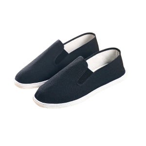 May include: A pair of black slip-on shoes with white soles. The shoes have a simple design, with a solid black upper and a white trim around the sole. The shoes are made of a soft, breathable material.