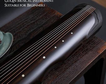 May include: A close-up of a dark wooden guqin, a traditional Chinese musical instrument, with strings and white markers. The text reads: "The Ancient Chinese Guqin Musical Instrument Suitable for Beginners."