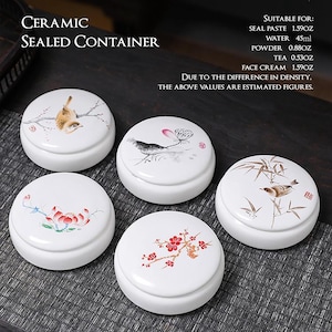 May include: White ceramic sealed containers with painted lids. Each lid features a unique design: a bird on a branch, a lotus flower, a bird with bamboo, a branch with red flowers, and a bird with a flower. The text on the image says "Ceramic Sealed Container".