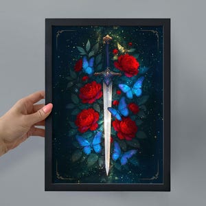 May include: Framed art print featuring a fantasy design. A silver sword is centered, surrounded by red roses and blue butterflies against a dark, starry background. The artwork is in a black frame.