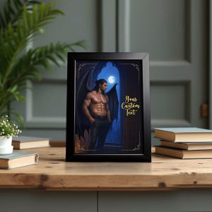 May include: Black framed art print featuring a muscular man with dark wings, standing in a gothic archway under a full moon. The print includes the text "Your Custom Text" in gold script.