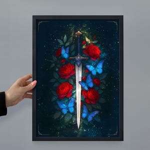 May include: Framed art print featuring a sword with a silver blade and ornate hilt, surrounded by red roses and blue butterflies. The artwork has a dark background with a touch of gold.