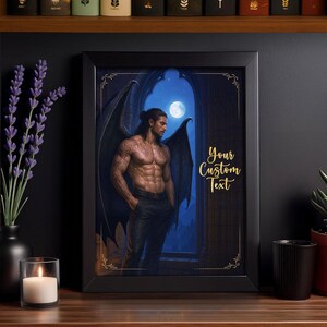 May include: Framed art print featuring a muscular man with dark wings, tattoos, and black pants, standing in front of a moonlit window. The text "Your Custom Text" is displayed in gold script. The frame is black.