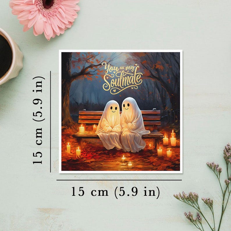 May include: A greeting card featuring two glowing ghosts sitting on a bench in a forest setting. The card has the text "You are my Soulmate" in gold lettering.