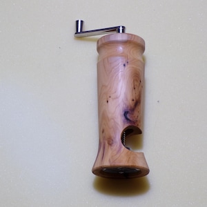 Nutmeg mill with cross hole in various types of wood