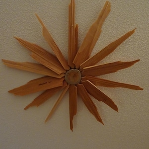 Evening star with rays made of split larch wood