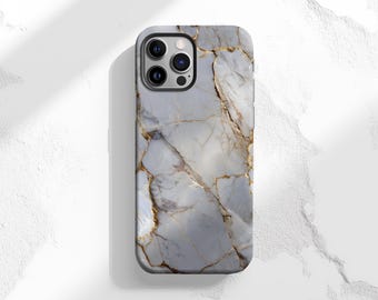May include: A smartphone case with a marble design. The case features a light gray and white pattern with gold-colored veining. The phone case has a black camera module.