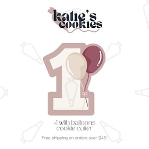 May include: A pink and white cookie cutter shaped like the number one with two balloons attached. The balloons are pink and beige. The text "#1 with balloons cookie cutter" is below the cookie cutter. The text "Free shipping on orders over $45!" is below the text about the cookie cutter.