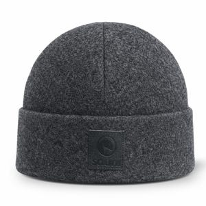 May include: A dark grey beanie hat with a turned-up brim. The hat has a textured finish and a small, square, black patch with a circular logo and the word "SOUL" on the front.