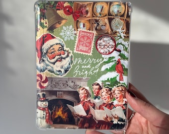 May include: A clear phone case with a Christmas-themed design. The design features a Santa Claus, a snowman, a fireplace, and a group of people singing carols. The text "merry and bright" is written in white cursive lettering.