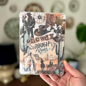 May include: A clear phone case featuring a Western-themed design. The case includes illustrations of cowboys, cacti, a horse, and the words "howdy ROUGH Rider". The color palette includes shades of brown, beige, and green.
