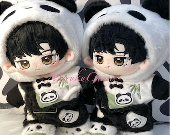 May include: Two plush panda dolls, each wearing a white panda hat with black ears and a black and white panda outfit. The dolls have black hair, brown eyes, and a built-in skeleton. 20cm built-in skeleton.
