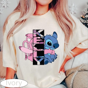 a woman wearing a t - shirt with a cartoon character on it