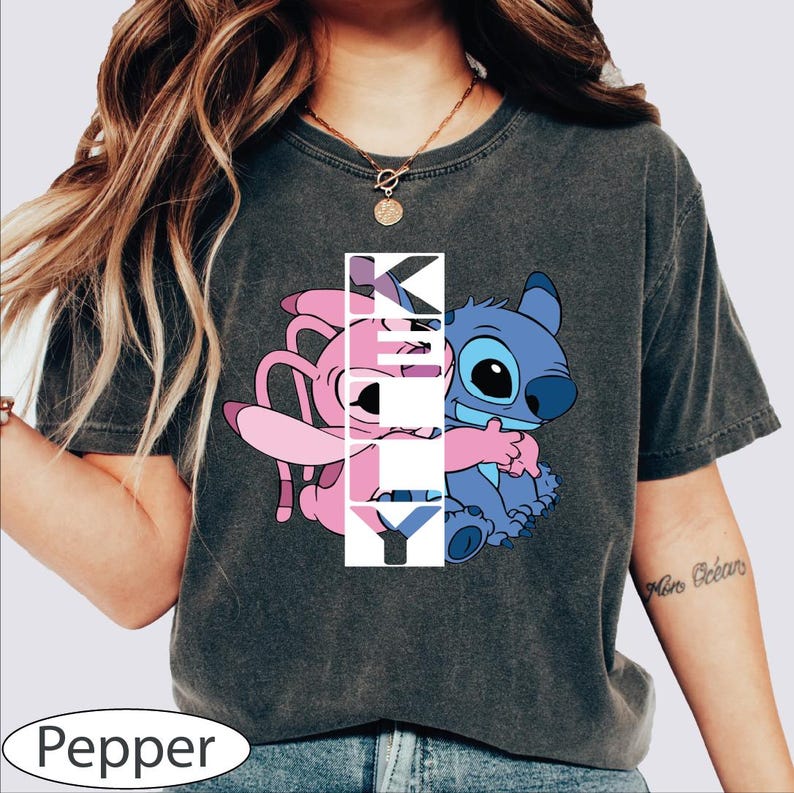 a woman wearing a t - shirt with a cartoon character on it