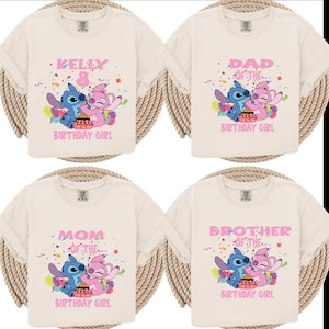 May include: Four cream-colored t-shirts with short sleeves. Each shirt features a cartoon image of blue and pink characters with the text "KELLY", "DAD", "MOM", and "BROTHER" above the words "BIRTHDAY GIRL".