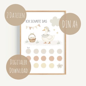 May include: A framed print featuring a watercolor illustration of a white duck wearing a bonnet, standing near a basket of eggs. The print includes the text "ICH SCHAFFE DAS" and a series of colored circles. The print is labeled "DIGITALER DOWNLOAD" and "DIN A4".