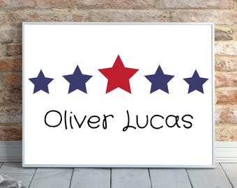 May include: A white framed print with five stars, four blue and one red, and the names Oliver Lucas written in black.