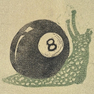 May include: A graphic illustration of a snail with a black billiard ball as its shell. The ball features a white circular inlay with the number 8 printed in black. The snail body is textured with a green speckled pattern on a light background.