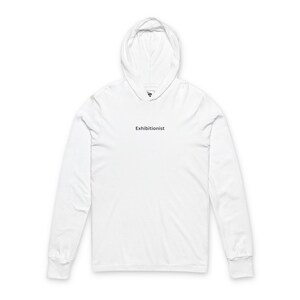 May include: White long-sleeve hoodie with the word "Exhibitionist" printed in black. The hoodie has a hood and ribbed cuffs. The garment is made of a soft, comfortable material.