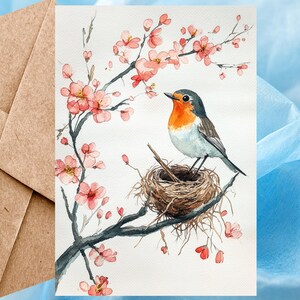 Jolie carte de voeux de printemps rouge-gorge - aquarelle rouge-gorge sur son nid avec des fleurs de printemps blanches dans un arbre, carte à l'unité avec enveloppe ou lot de cinq