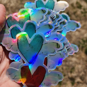 Holographic winged hearts sticker