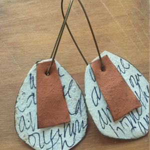 black and white doodle earrings with terra cotta