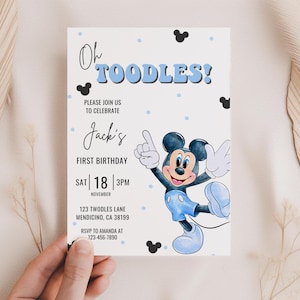 May include: A blue and white birthday invitation featuring a cartoon illustration of Mickey Mouse. The invitation reads "Oh Toodles!" and "Jack's First Birthday".