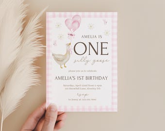 May include: Pink and white gingham birthday invitation with a watercolor illustration of a goose holding balloons. The text reads "Amelia is One silly goose" and includes details for Amelia's 1st birthday party.