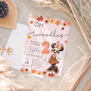 May include: A rectangular birthday invitation card on a light pink background featuring a cartoon mouse character wearing a plaid dress and bow, an orange balloon shaped like the number 2, and autumn leaf illustrations with the text Oh Twoodles.