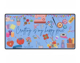 May include: A blue background with a variety of colorful crafting supplies, including buttons, thread, scissors, and a sewing machine. The text "Crafting is my happy place" is written in a white cursive font.