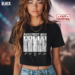 May include: Black crop top featuring the text "BACKSTREET BOYS" above a black and white image of the band members. The shirt also includes the band members' signatures. The word "BLACK" is in the top left corner.