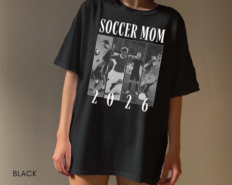 May include: Black t-shirt with the text "SOCCER MOM 2026" in white. The design includes a series of black and white images of soccer players. The shirt is a casual, short-sleeved style.