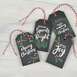 May include: Four black gift tags with white lettering and green and red illustrations. The tags read "Making Spirits Bright", "Wishing You a Merry Little Christmas", "Merry Christmas", and "Wishing You Joy".