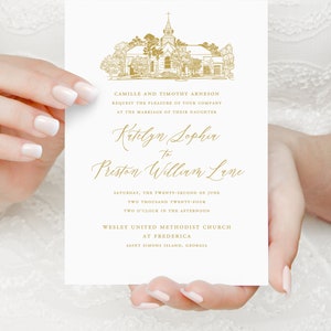 May include: Wedding invitation with gold lettering announcing the marriage of Katelyn Sophia to Preston William Lane. The invitation features a gold illustration of a church with a spire and trees. The wedding will take place on Saturday, 22nd June 2024, at two o'clock in the afternoon at Wesley United Methodist Church in Frederica, Saint Simons Island, Georgia.