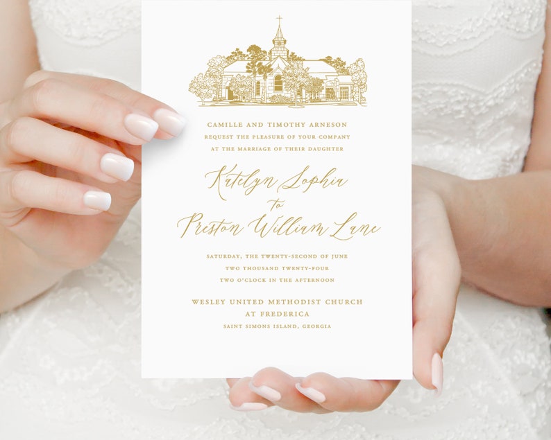 May include: Wedding invitation with gold lettering announcing the marriage of Katelyn Sophia to Preston William Lane. The invitation features a gold illustration of a church with a spire and trees. The wedding will take place on Saturday, 22nd June 2024, at two o'clock in the afternoon at Wesley United Methodist Church in Frederica, Saint Simons Island, Georgia.