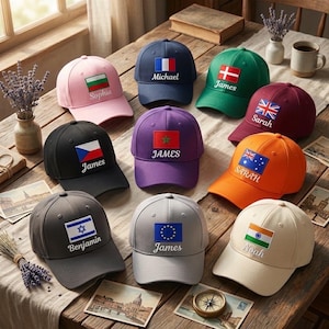 May include: A selection of baseball caps in different colours, each with a flag patch and a name embroidered underneath. The caps display flags from Bulgaria, France, Denmark, the UK, the Czech Republic, Morocco, Australia, Israel, the EU, and India.