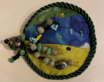 Silk Brooch, Patchwork Silk, Bead Embroidery, Leather, Silk, Beads, Titled “Mountain Meadow, Quilted Silk, Embroidered Silk and Beads