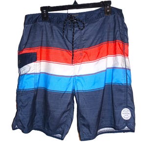 May include: Blue, red, and white striped swim trunks with a black Rip Curl logo on the right leg.