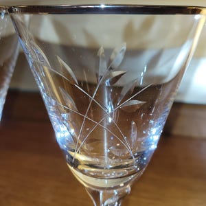 High Quality Etched Glasses with Sterling Silver Rims. Very Beautiful Craftsmanship in Amazing Condition.