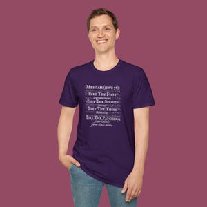 May include: Purple t-shirt with a white graphic print of the text "MESSIAH (HWV 56)" and "PART THE FIRST", "PART THE SECOND", "PART THE THIRD", "PART THE PAYCHECK (CHA-CHING)".