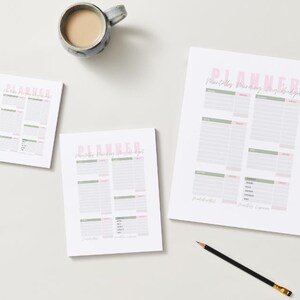 May include: Three white paper planners with pink and green text and a mug of coffee on a white surface. The planners have the word "PLANNER" at the top. A pencil is also on the surface.