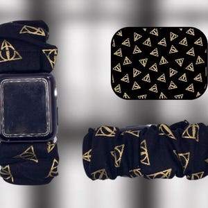 May include: Black Apple Watch band with a gold and black pattern of the Deathly Hallows symbol. The band is made of a soft, stretchy material and is compatible with most Apple Watch sizes.