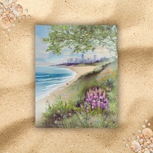 May include: A watercolor painting of a beach scene with a city skyline in the distance. The beach is covered in green grass and wildflowers, with a blue ocean in the foreground. The sky is a light blue with white clouds.