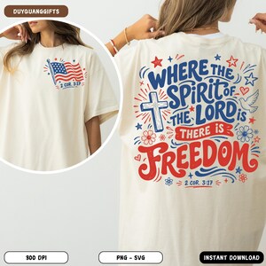 May include: An off-white t-shirt featuring a small American flag graphic on the front left chest with the text 2 COR. 3:17. The back displays a large graphic with a cross, a dove, flowers, stars, and the text WHERE THE SPIRIT OF THE LORD IS THERE IS FREEDOM 2 COR. 3:17 in red and blue.