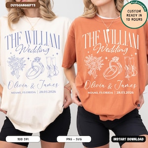 May include: Two crewneck t-shirts, one cream and one burnt orange, featuring the text THE WILLIAM Wedding, Olivia & James, MIAMI, FLORIDA | 28.03.2026, alongside line art illustrations of a floral bouquet, two wedding rings, and two champagne flutes.